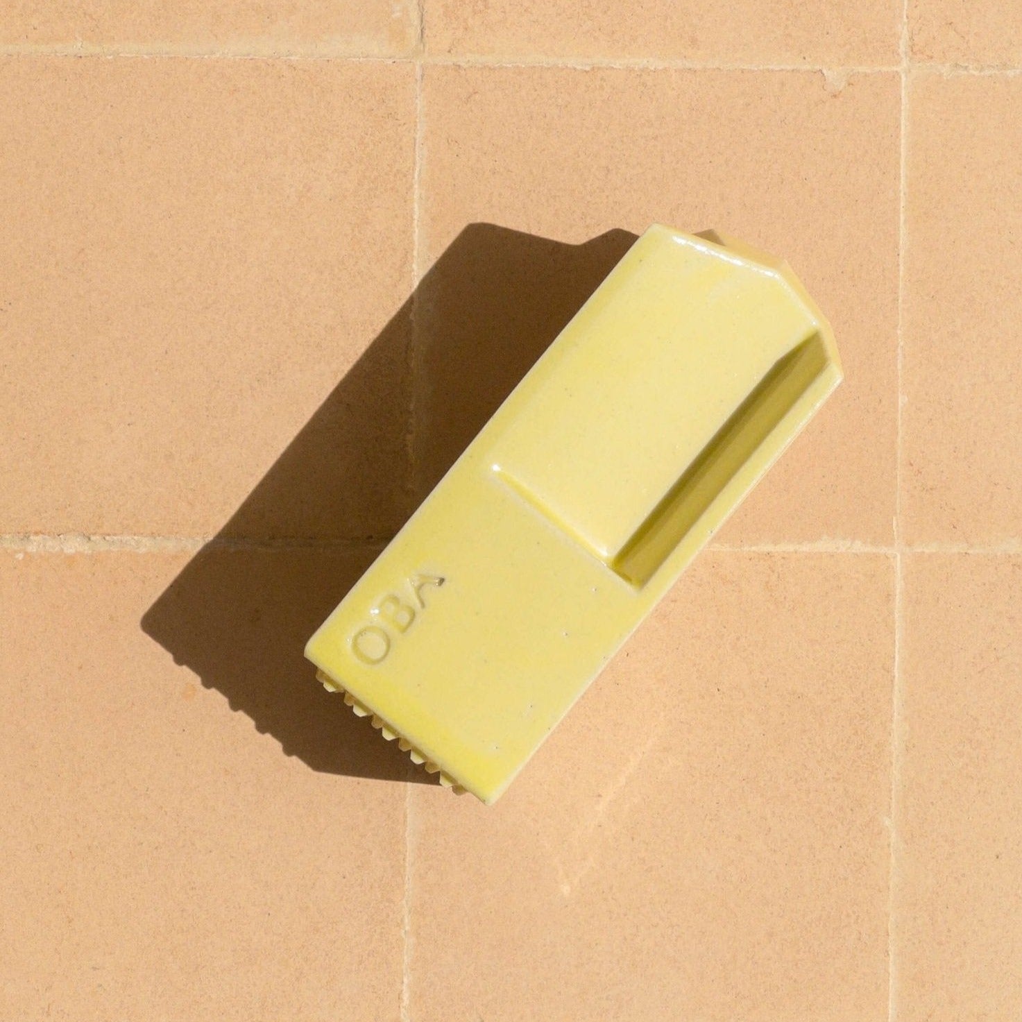 Lemon squeezer and ginger grater in yellow